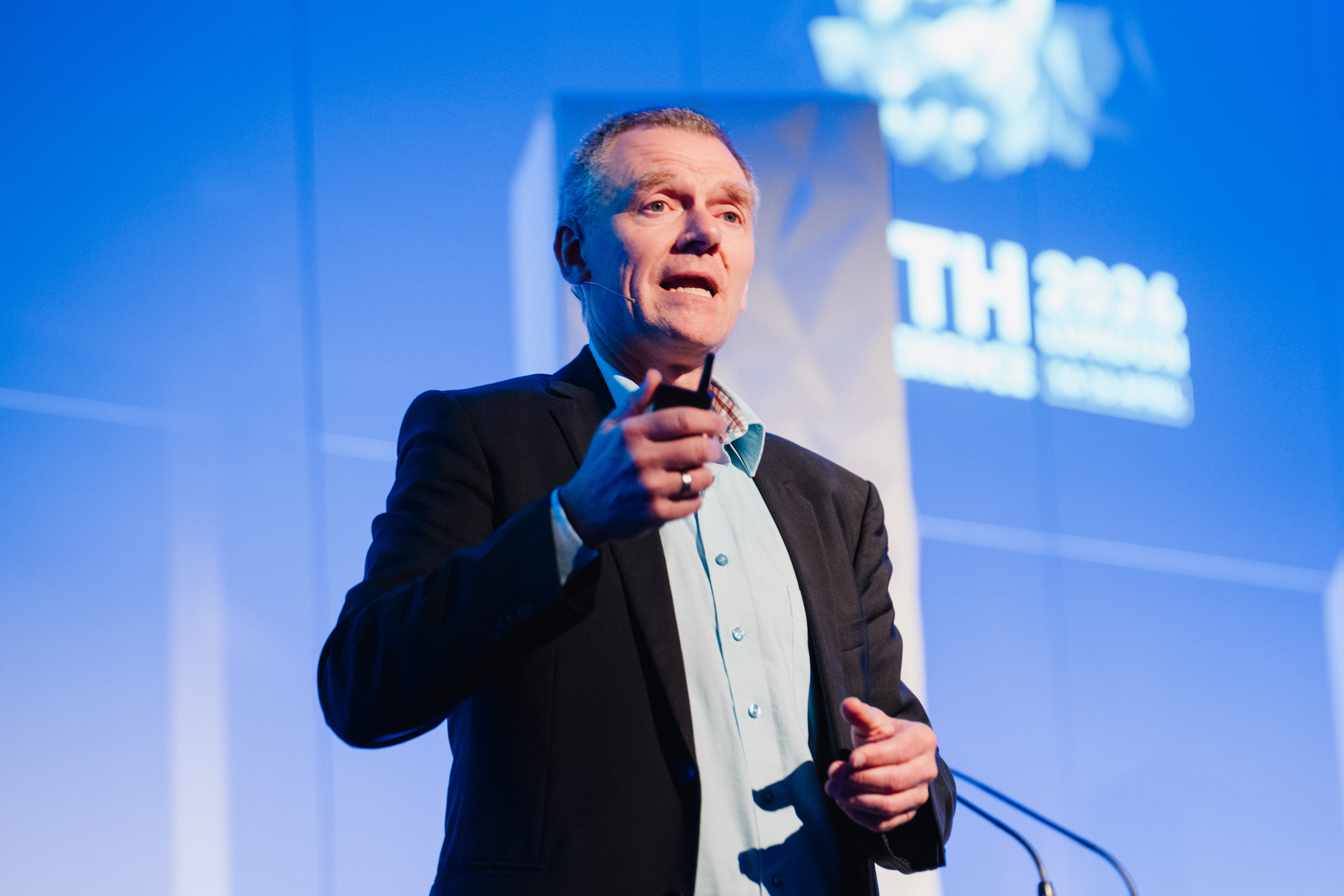 Speaker addressing the audience at a previous FTTH Conference